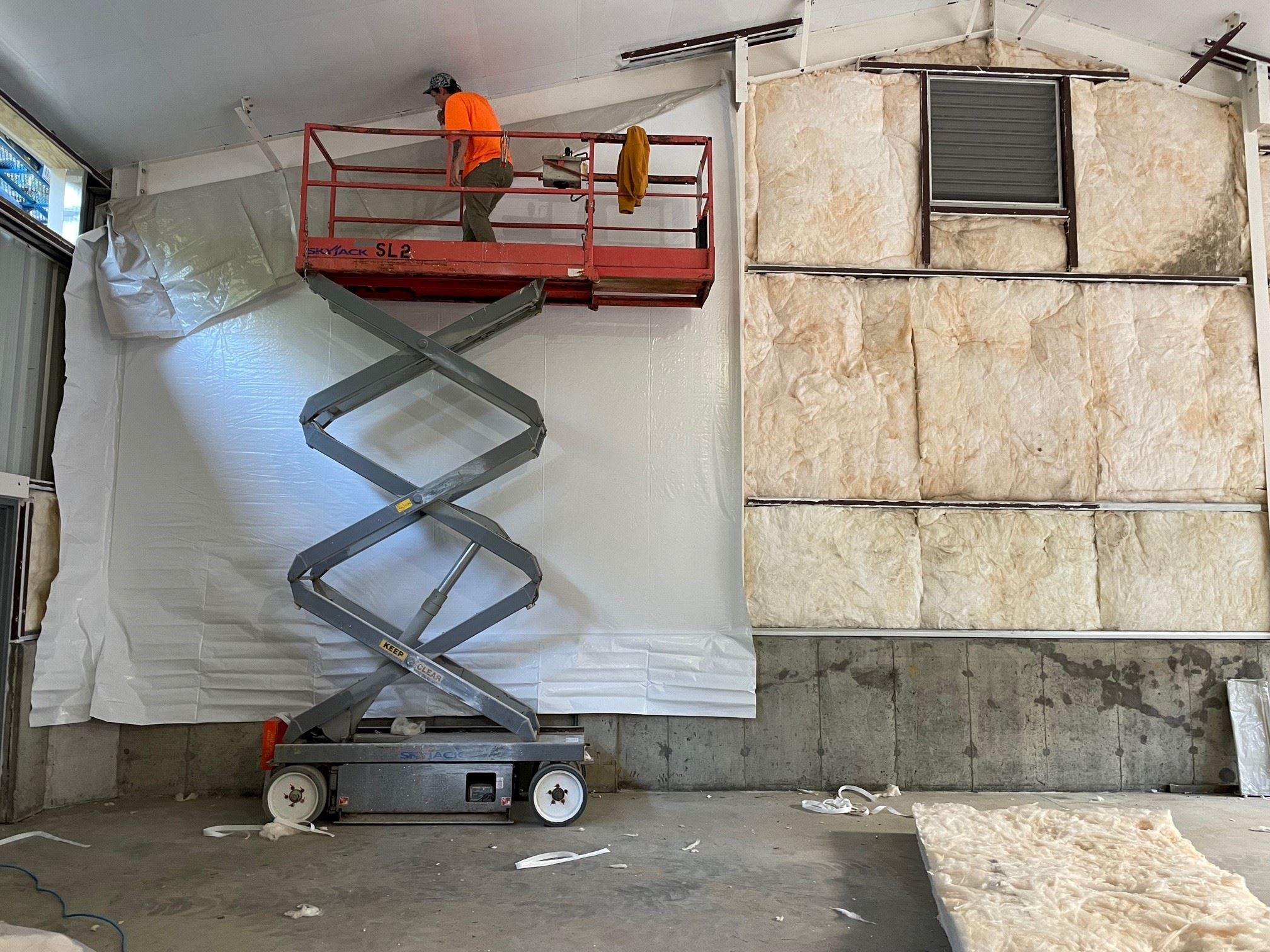 Installation of the Wall Insulation and Fabric Vapor Barrier